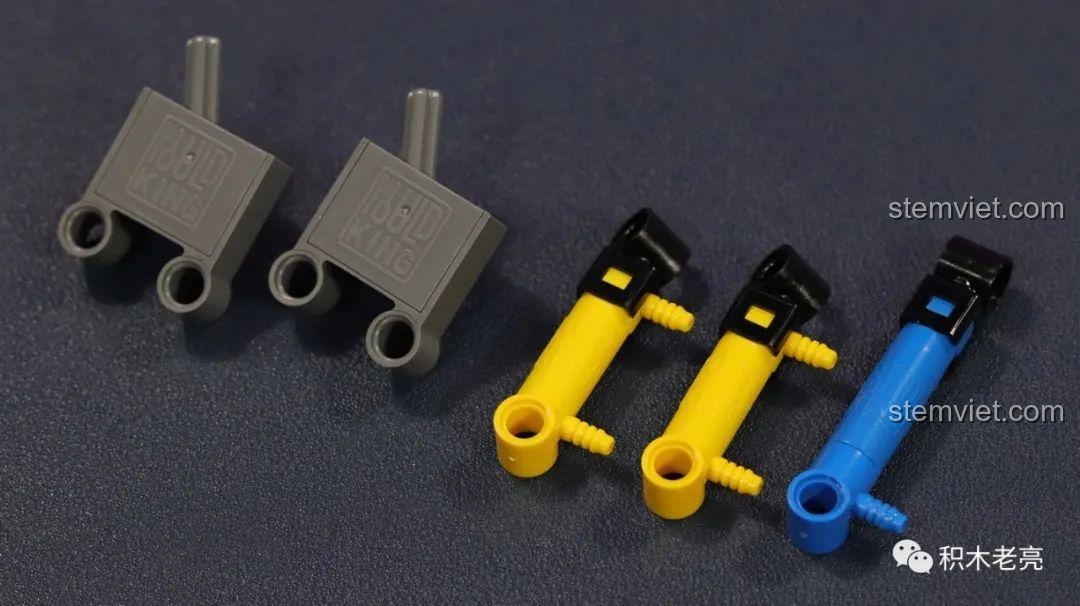 Cận cảnh các chi tiết xi lanh và pít-tông khí nén trong bộ Mould King 19001, có logo Mould King dập nổi rõ nét.