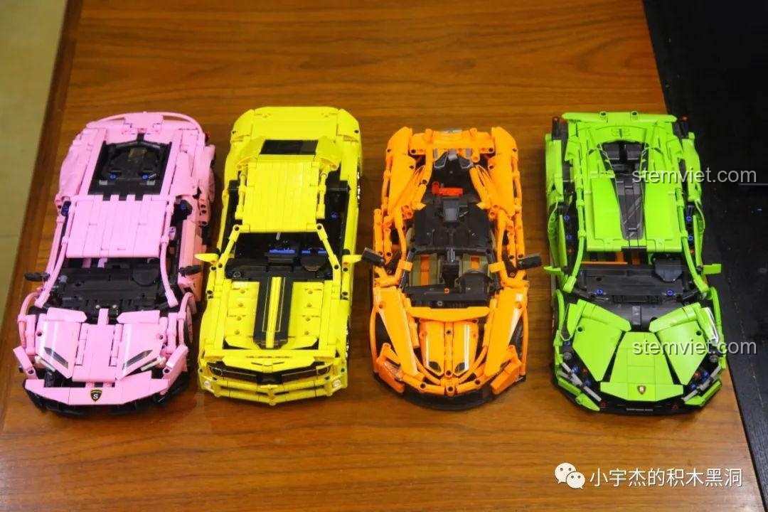 Dàn siêu xe lắp ráp 1:14 nhiều màu sắc được trưng bày trên bàn gỗ.