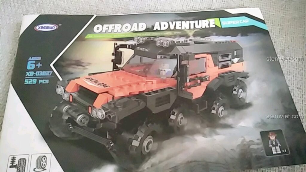 Vỏ hộp của bộ lắp ráp Xe Địa Hình 8 Bánh Siberian Conqueror XB-03027, hiển thị hình ảnh chiếc xe màu cam đen hầm hố.