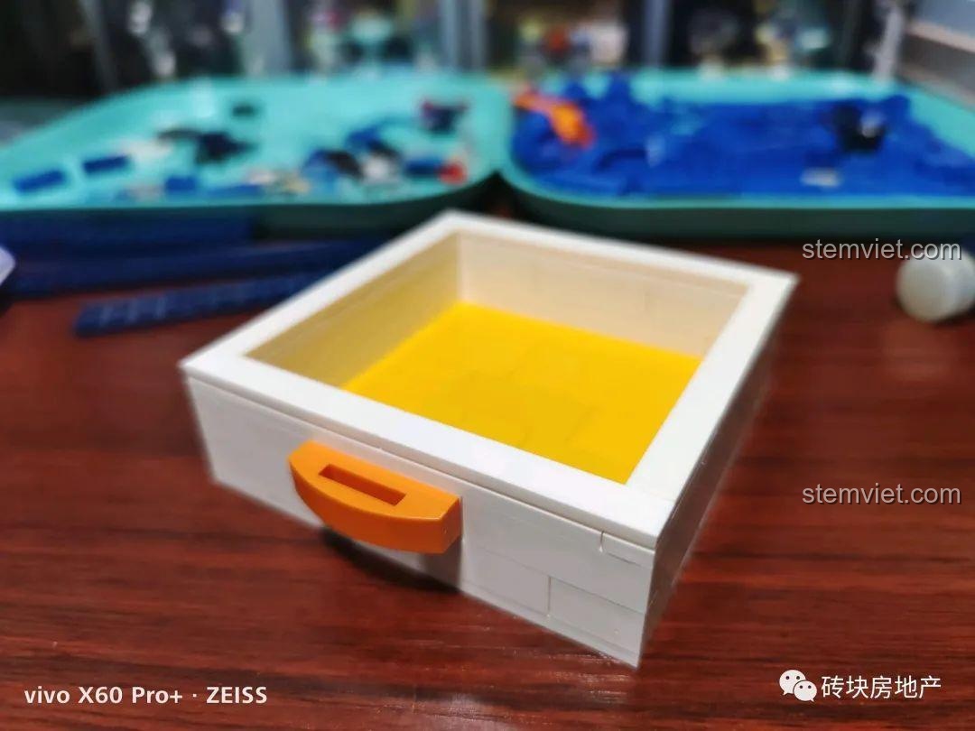 Ngăn kéo nhỏ bí mật được lắp ráp hoàn chỉnh trong bộ đồ chơi sáng tạo Hộp nhạc sóng biển cho con gái.