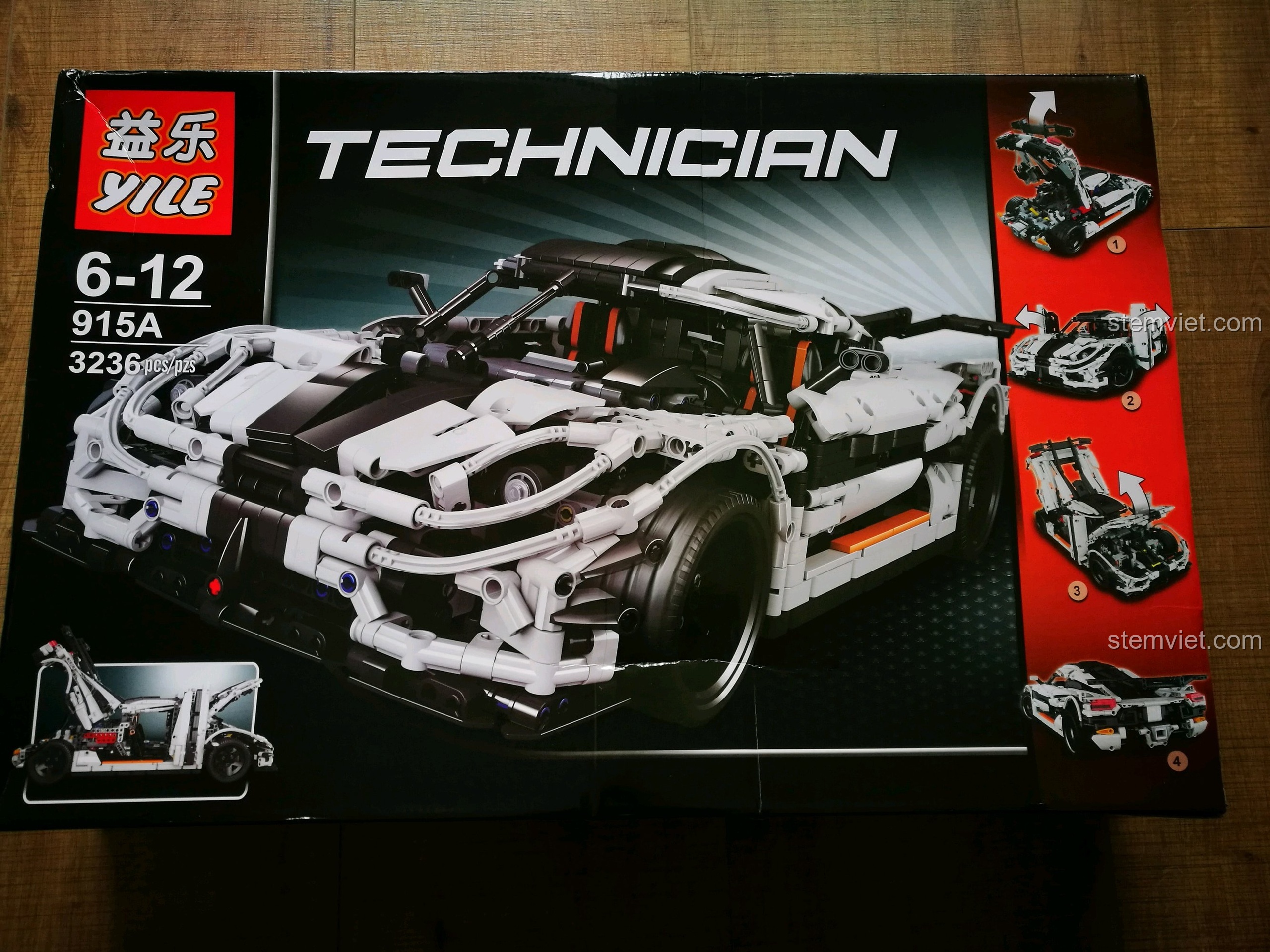 Hộp sản phẩm bộ đồ chơi lắp ráp Mô hình Koenigsegg One:1 YILE 915A với hình ảnh siêu xe trắng đen cực ngầu.