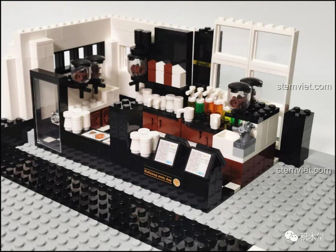 Trang hướng dẫn lắp ráp bộ đồ chơi lắp ráp Juhang Technology 86007 Quán Cà Phê Góc Phố, minh họa cách tích hợp hệ thống đèn LED vào cấu trúc.