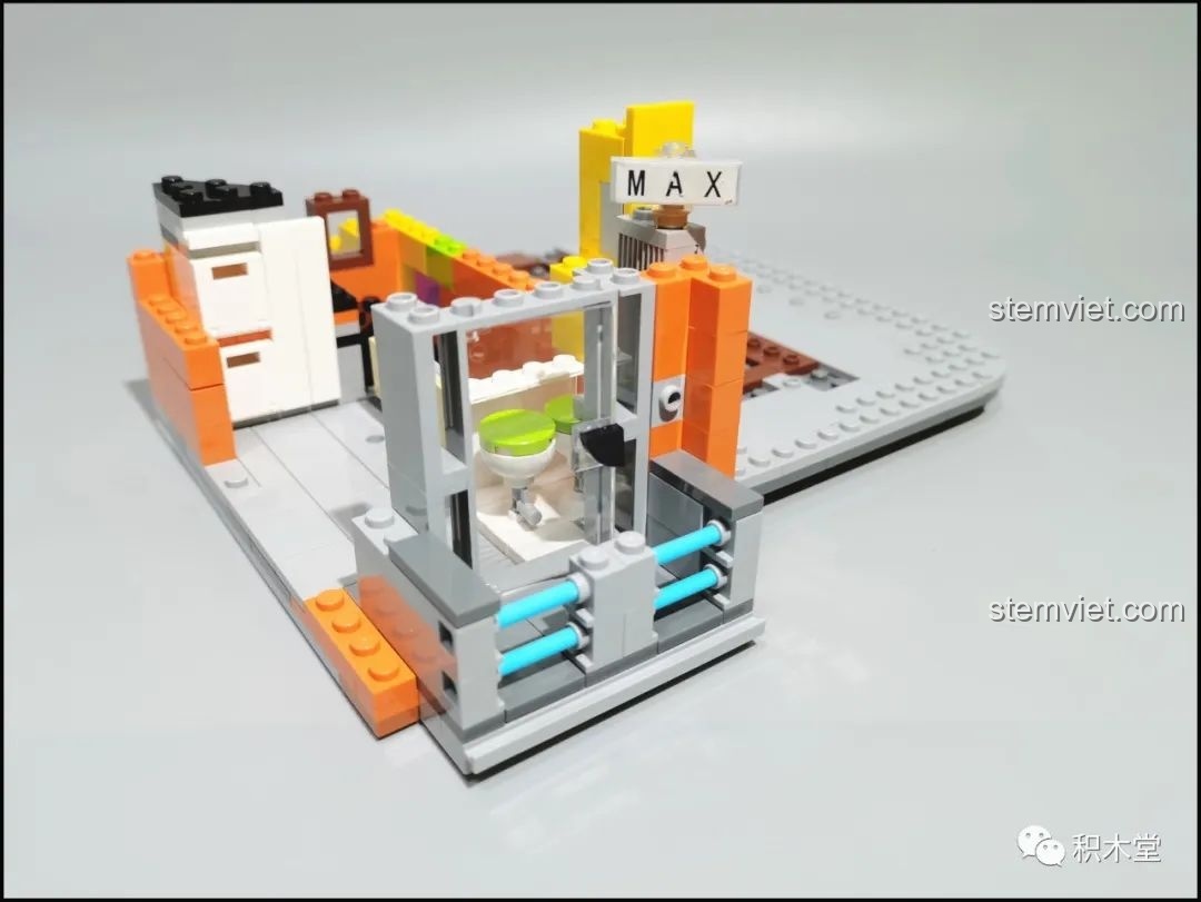 Lắp ráp khu vực nhà vệ sinh trên tầng 2 với các chi tiết màu xanh ngọc và trắng.