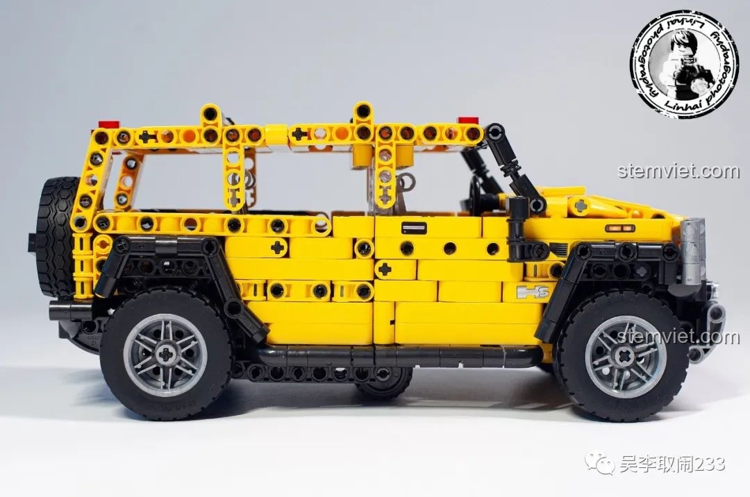 Mô hình xe Hummer H2 FC9120 hoàn thiện nhìn từ bên hông, màu vàng nổi bật và thiết kế hầm hố.