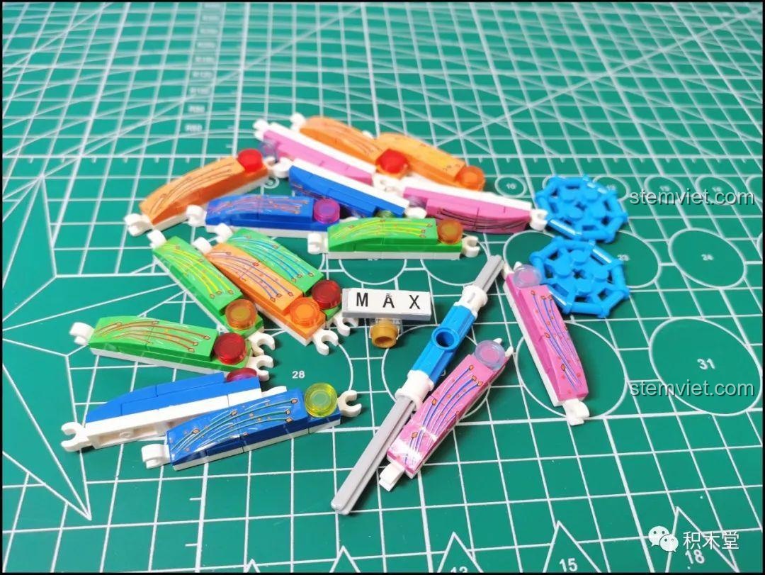 Các nan hoa đầy màu sắc của vòng quay Ferris Wheel đang được lắp ráp, chuẩn bị cho việc gắn các cabin.