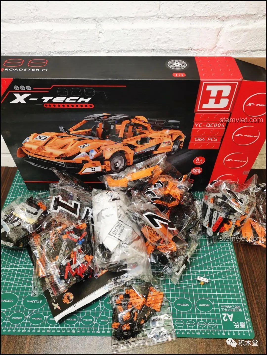 Toàn bộ mảnh ghép của bộ Happy Build YC-QC004 Siêu xe McLaren P1 sau khi mở hộp, cho thấy sự đầy đặn và đa dạng chi tiết.