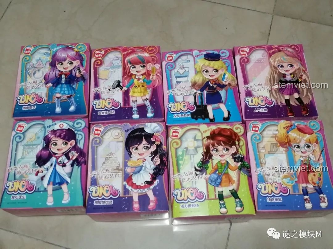 Trọn bộ 8 hộp nhỏ trong set đồ chơi QMAN 34011, mỗi hộp là một nhân vật UNA với nghề nghiệp khác nhau.