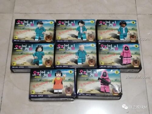 Ảnh chụp thực tế 8 hộp sản phẩm của bộ minifigure Renzaima 101, cho thấy bao bì của từng nhân vật trong phim Squid Game.