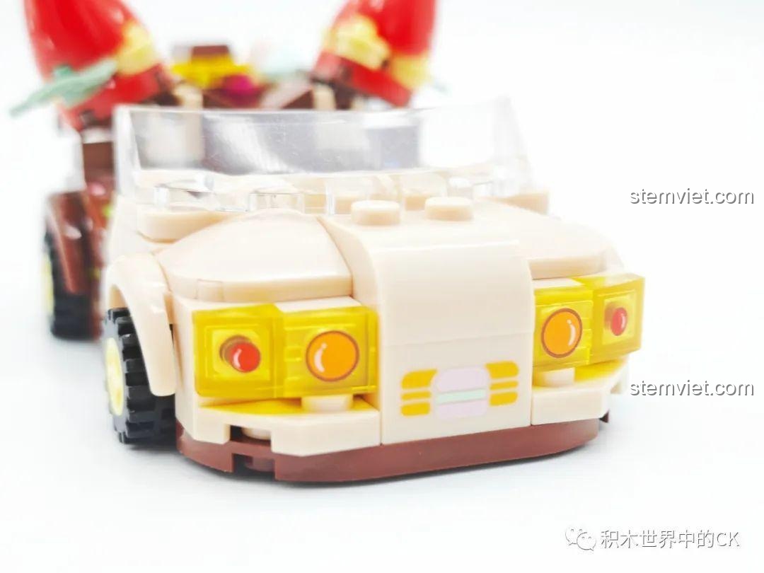 Cận cảnh phần đầu xe của mô hình Sembo 615001 Xe Dâu Tây Donut, với đèn pha và chi tiết trang trí.