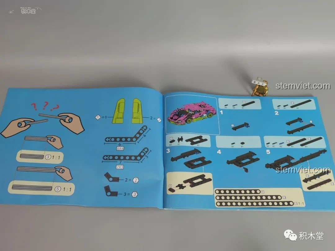 Trang hướng dẫn trong sách của Wanzhi 9803 có thước đo tỉ lệ 1:1 cho các trục và chi tiết dài.