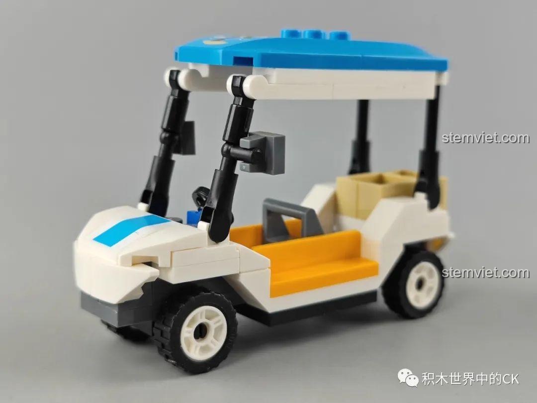 Mô hình xe điện sân golf của bộ GUDI 10501 Máy bay tham quan Yakai, nhìn từ góc nghiêng, với ghế ngồi màu vàng và mái che xanh.