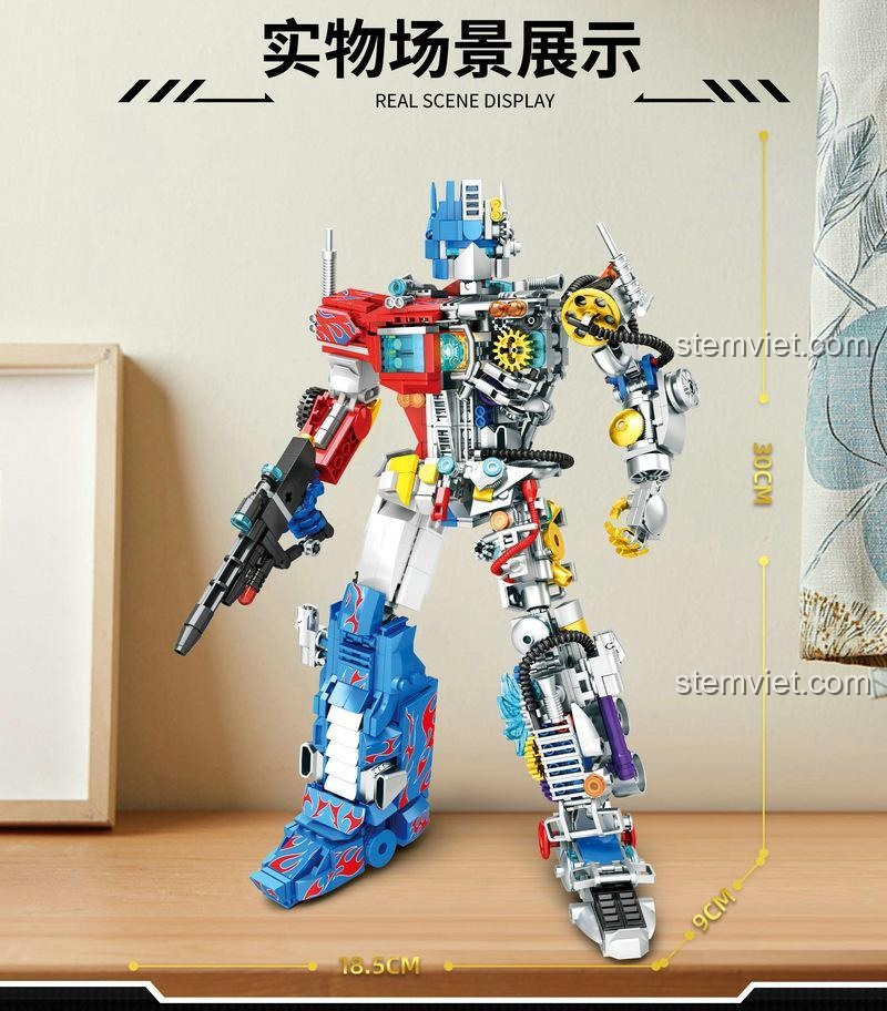 Hình ảnh thể hiện kích thước thực tế của mô hình Optimus Prime YMI 6066, cao 30cm, rộng 18.5cm, một món quà giá tốt và ấn tượng.