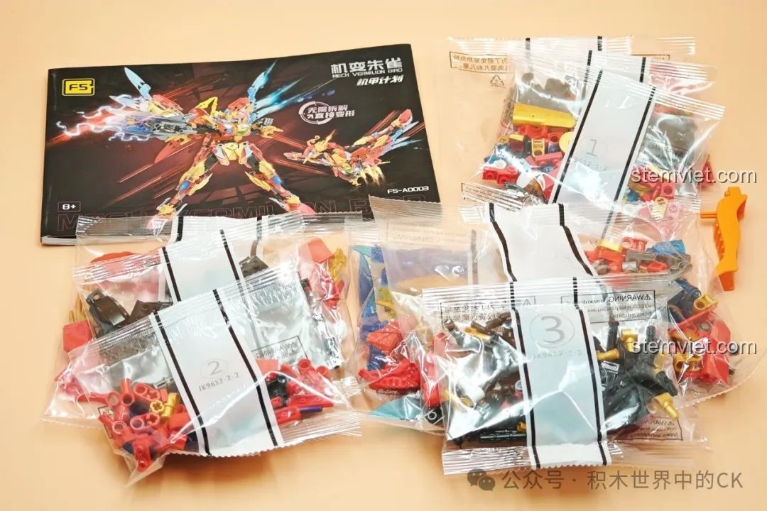 Bộ lắp ráp Mecha Phượng Hoàng Lửa F5-A0003 với các túi chi tiết được đánh số và sách hướng dẫn chi tiết.
