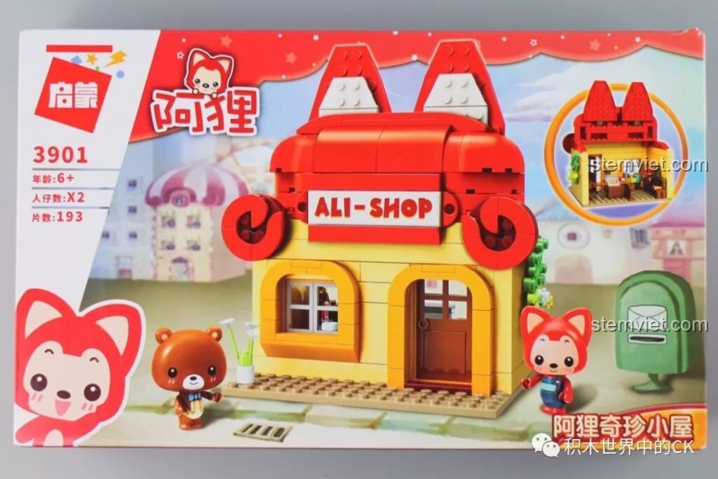 Hộp bộ lắp ráp QMAN 3901 Cửa hàng A-li với hình ảnh nhân vật A-li và Gấu, cùng các chi tiết sản phẩm.