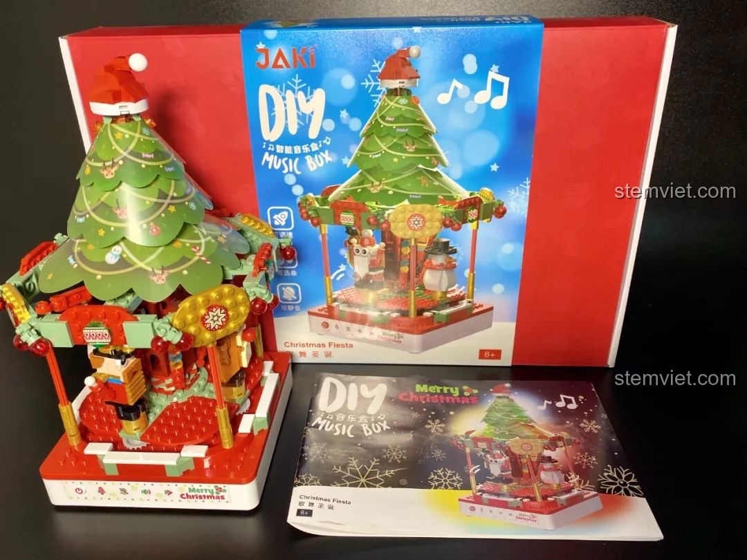 Hình ảnh quảng cáo Hộp nhạc Giáng Sinh Xoay Tự Động JAKI JK1365 với thông điệp về đế nhạc thông minh. Đồ chơi lắp ráp Giáng Sinh có nhạc.