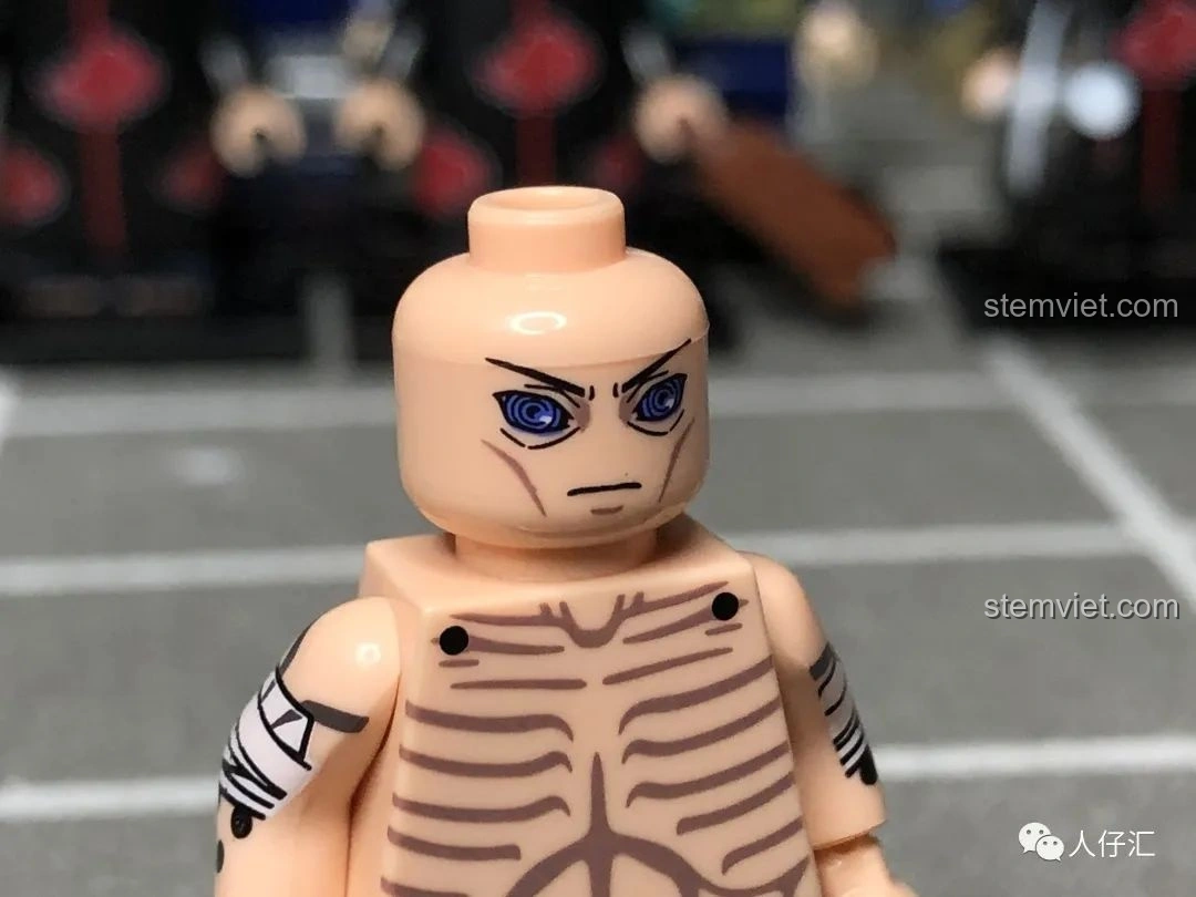 Cận cảnh khuôn mặt Nagato WM2091, với đôi mắt Rinnegan được in ấn sống động.