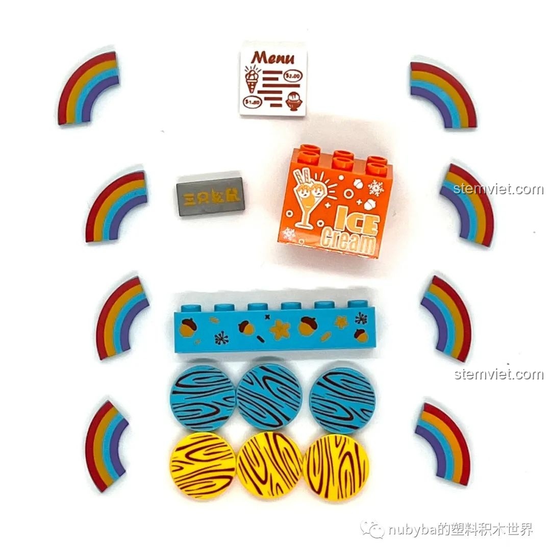 Các chi tiết in hình cầu vồng và menu kem trong bộ lắp ráp Xe Kem Ngon Lành của JAKI.