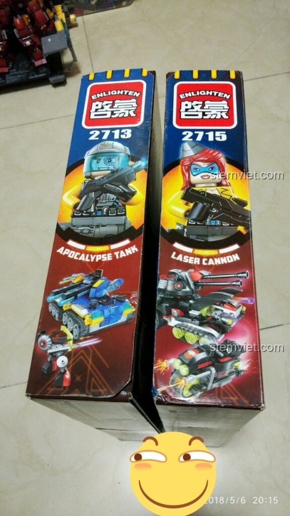 Cận cảnh hai hộp đồ chơi lắp ráp QMAN 2713 Apocalypse Tank và 2715 Laser Cannon thuộc series Kỷ Nguyên Công Nghệ Cao.