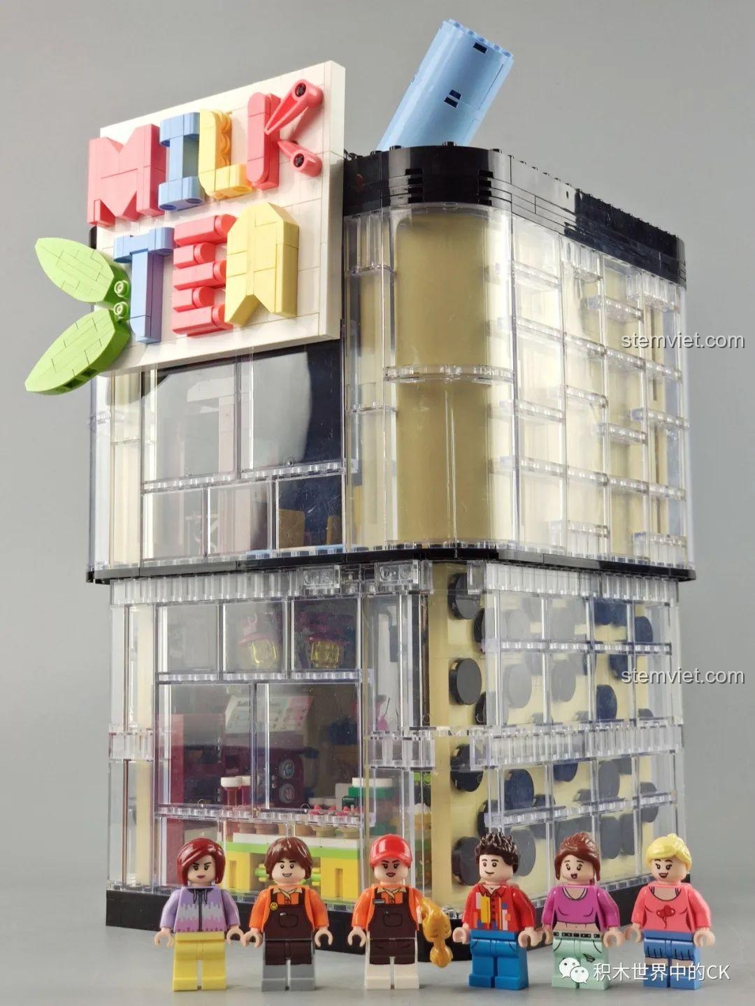 Mô hình Cửa hàng trà sữa JIAZHI SY 5209 sáng đèn trong bóng tối, thể hiện hiệu ứng đèn LED đẹp mắt.