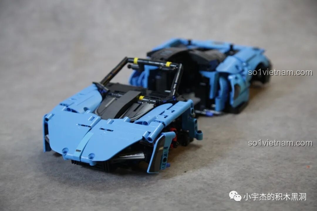 Phần đầu xe của mô hình McLaren Senna GTR 673002 đang được lắp ráp, với các chi tiết đèn và lưới tản nhiệt.