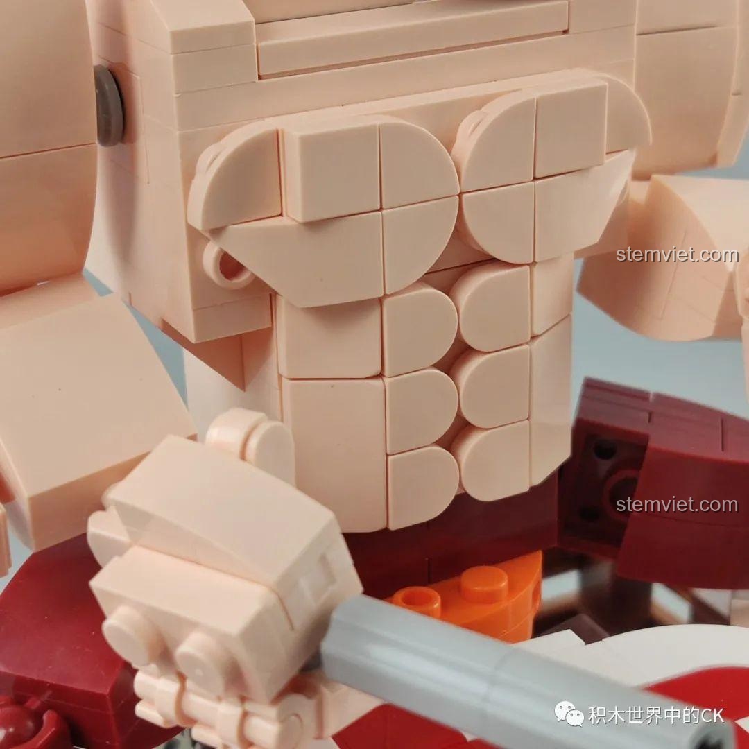 Cận cảnh khuôn mặt của mô hình người đàn ông trong bộ đồ chơi lắp ráp Hộp nhạc thịt bò viên JAKI JK1801, với biểu cảm hài hước.