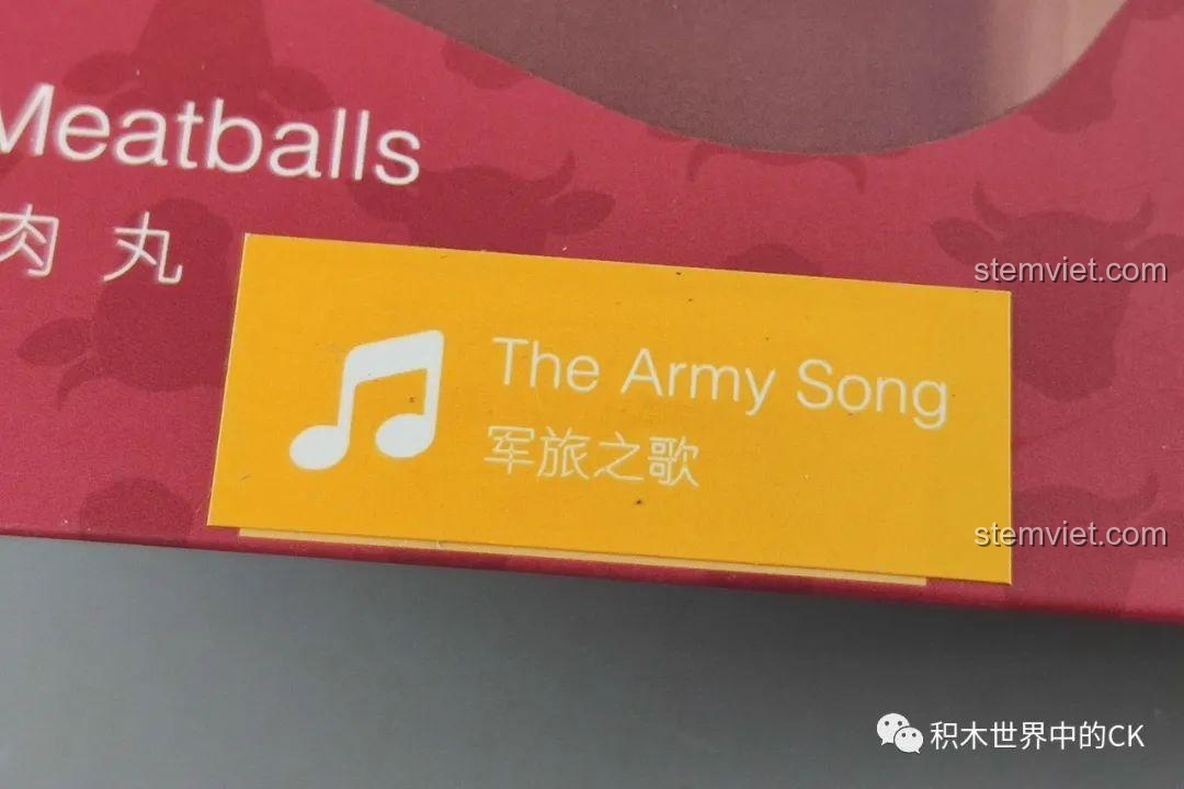Chi tiết nhãn dán trên hộp đồ chơi lắp ráp Hộp nhạc thịt bò viên JAKI JK1801, hiển thị tên bài hát 'The Army Song'.