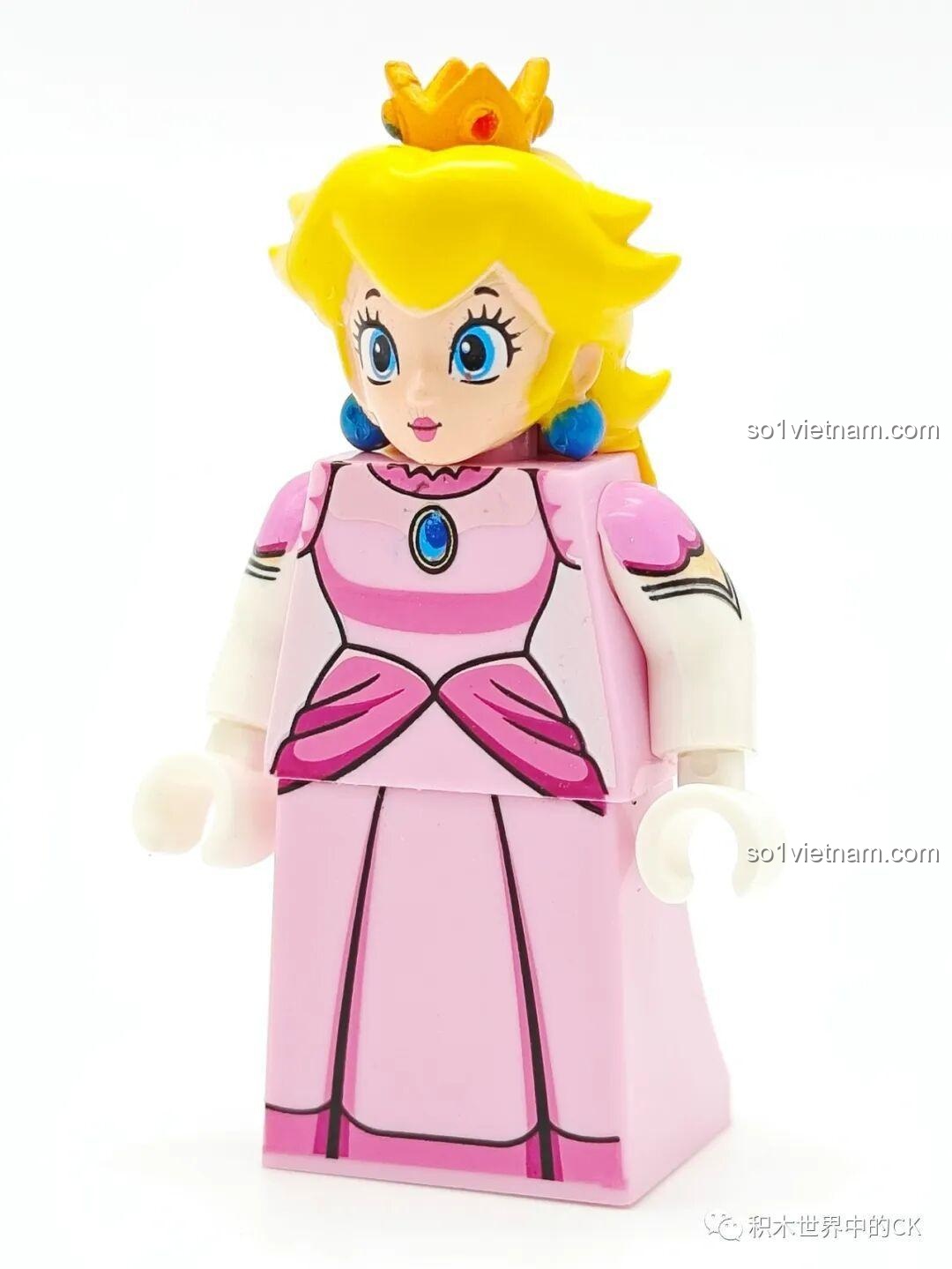 Đồ chơi mô hình Công chúa Peach WM2070 cho trẻ trên 6 tuổi, với bộ váy hồng và mái tóc vàng xinh đẹp.