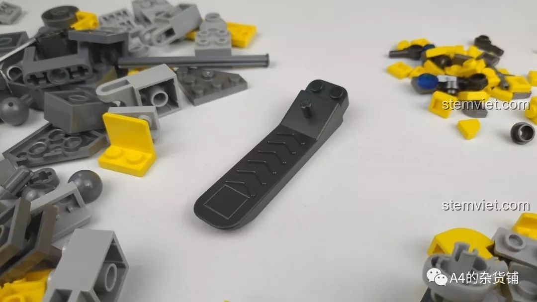 Dụng cụ tách mảnh màu đen đi kèm bộ Panlos Brick 621019 Robot Đại Hoàng Phong, hỗ trợ tháo lắp dễ dàng, tránh làm hỏng mảnh ghép.