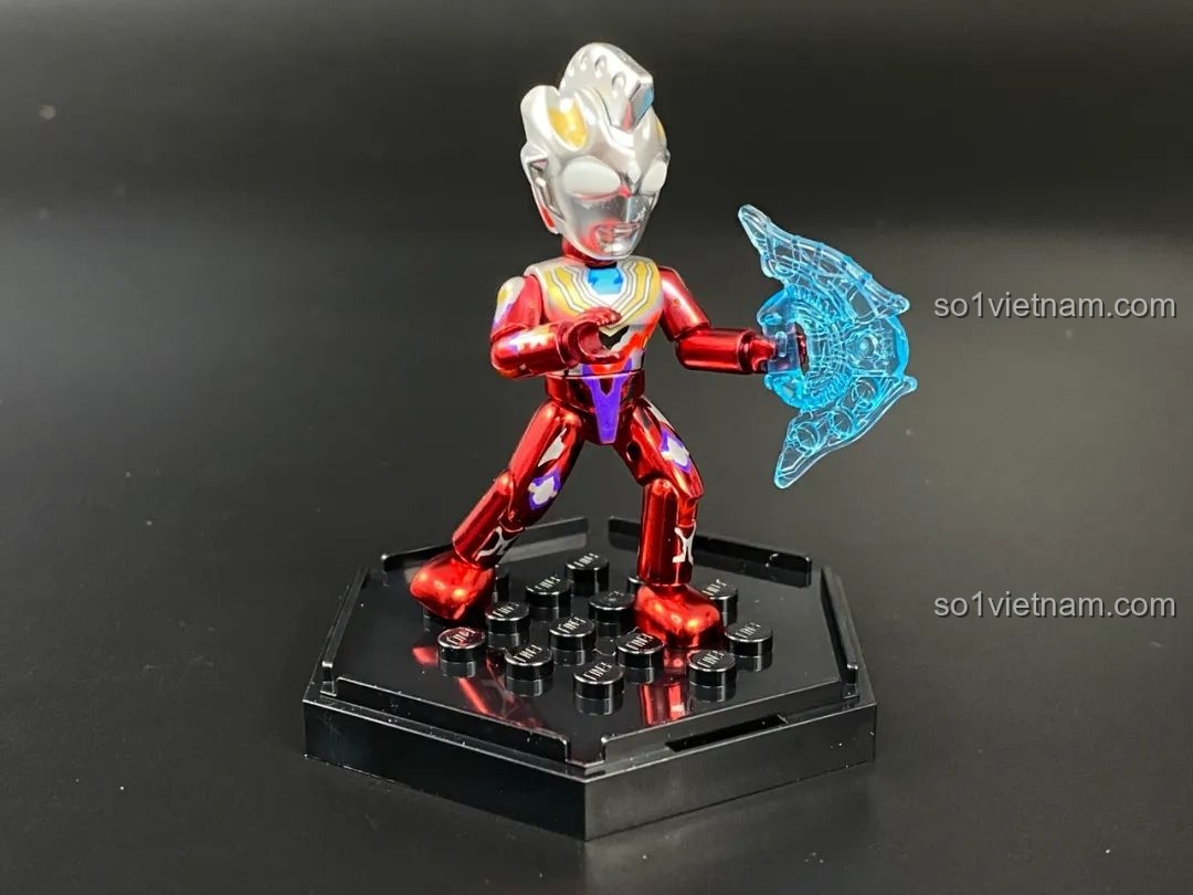 Figure Ultraman Geed phiên bản sơn bóng tạo dáng với hiệu ứng năng lượng.