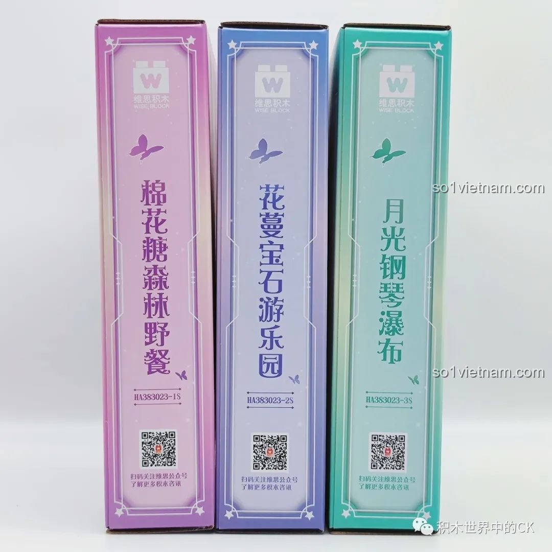 Gáy của ba hộp trong bộ sưu tập hoa lớn AULDEY, với tên của từng mẫu: Khu rừng kẹo, Khu vui chơi đá quý, Thác piano.