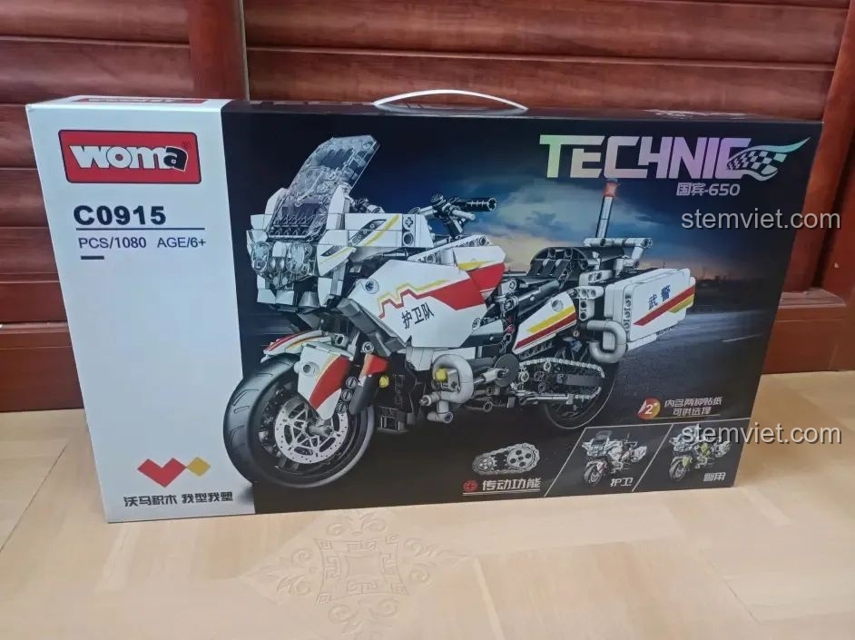 Mặt trước hộp bộ lắp ráp WOMA C0915 Mô tô Quốc Bân-650, hiển thị hình ảnh mô hình hoàn chỉnh và các tính năng nổi bật.