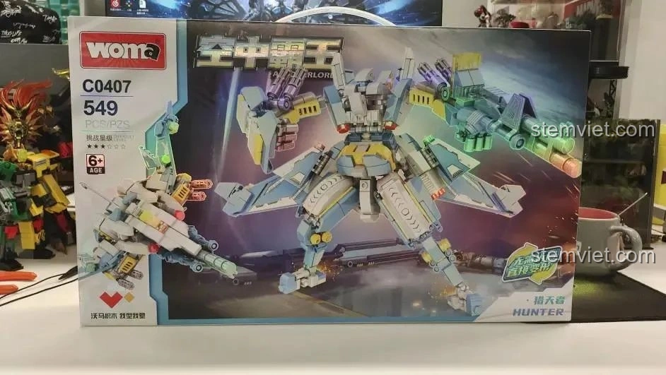 Hộp đồ chơi lắp ráp WOMA C0407 Robot Biến Hình Không Trung Bá Vương - Thợ Săn Trời với hình ảnh robot và chiến cơ.