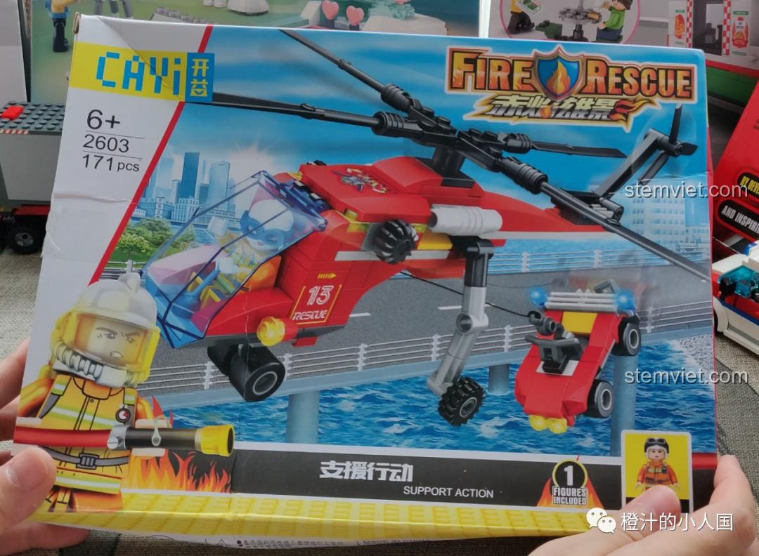 Mặt trước hộp bộ lắp ráp CAYI 2603 Trực Thăng Cứu Hộ Hỏa Tuyến, phù hợp cho bé trai trên 6 tuổi.