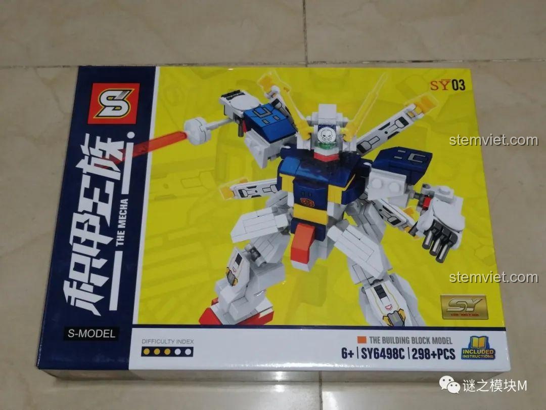Hộp đồ chơi lắp ráp SY6498C Crossbone Gundam X-1, với hình ảnh robot màu xanh vàng độc đáo.