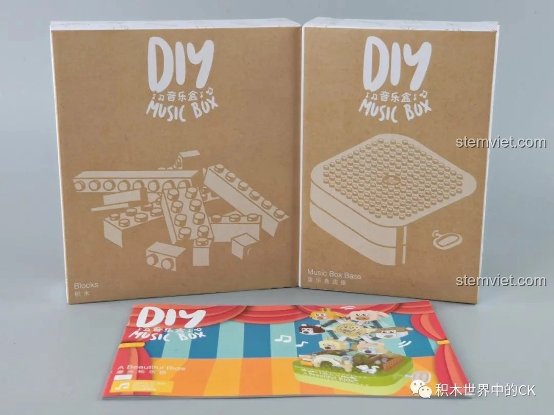 Các hộp nhỏ và sách hướng dẫn của bộ lắp ráp hộp nhạc vòng quay kỳ diệu JAKI
