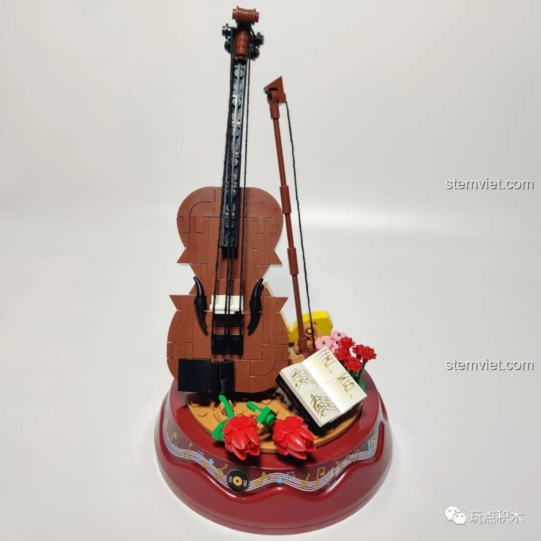 Mô hình hộp nhạc WOMA C0362 Violin hoàn chỉnh, với cây đàn violin màu nâu và các bông hoa hồng trang trí.