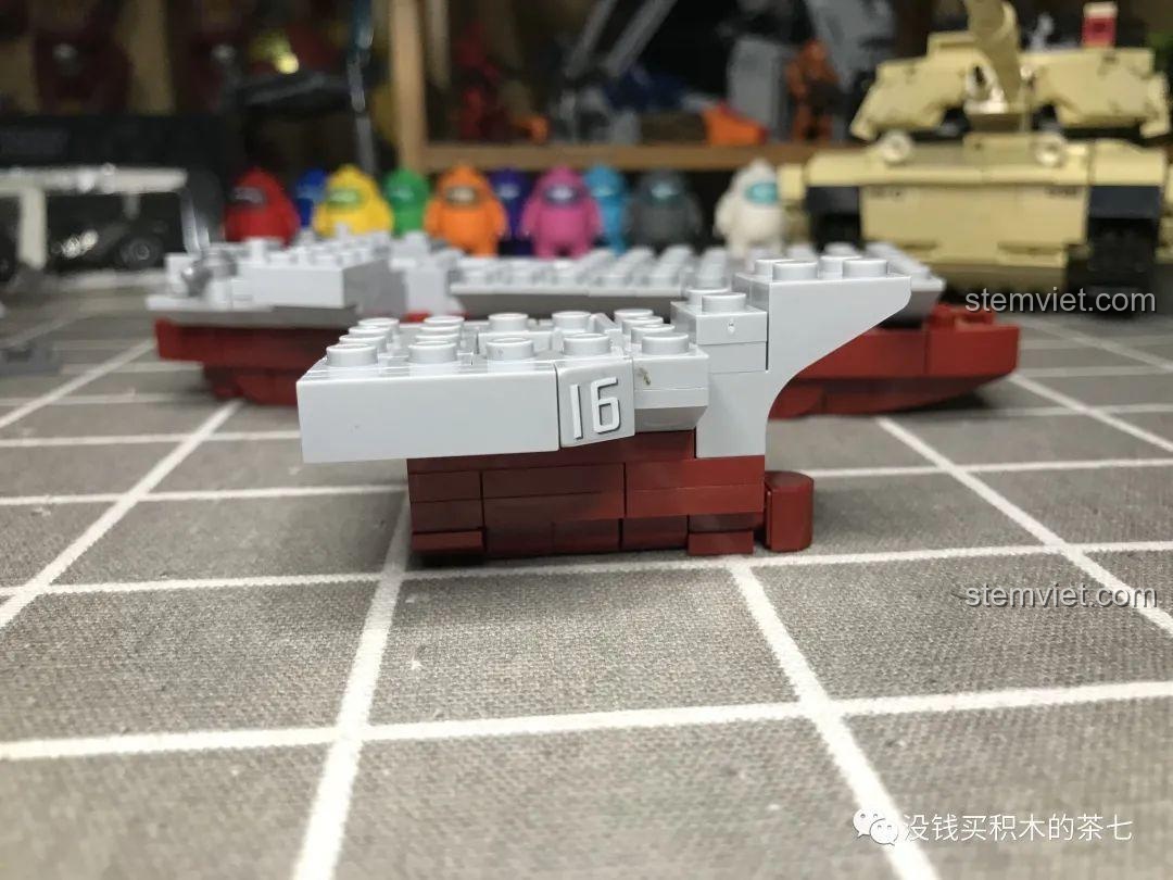 Trang hướng dẫn lắp ráp số 25 của bộ Jia Zhi 1562, hiển thị cách lắp phần boong tàu sân bay Liêu Ninh với các mảnh ghép đen và sticker.