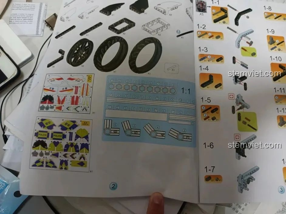 Trang sách hướng dẫn lắp ráp WOMA C0915 Xe mô tô cảnh sát Quốc Bân-650 với thước đo 1:1 để kiểm tra kích thước chi tiết.