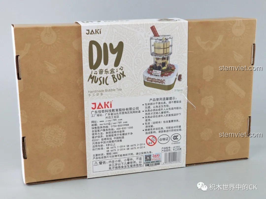 Chi tiết nhãn dán trên hộp đồ chơi lắp ráp Hộp nhạc trà sữa JAKI, hiển thị tên bài hát 'Waltz of the Flowers'.