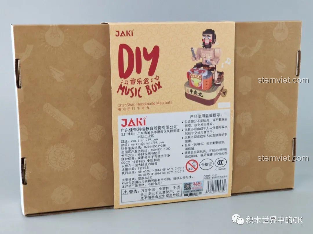 Mặt sau hộp đồ chơi lắp ráp Hộp nhạc thịt bò viên JAKI JK1801, hiển thị thông tin chi tiết sản phẩm và cảnh báo an toàn.