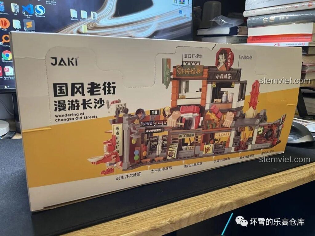 Hộp sản phẩm bộ lắp ráp JAKI JK2131 Phố Cổ Trường Sa với hình ảnh các mô hình quán ăn mini sống động, thu hút sự chú ý của trẻ em và người lớn.