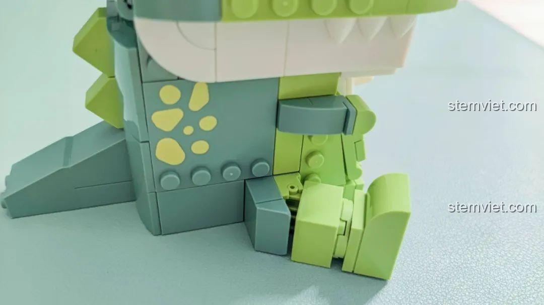 Hộp bút Khủng long T-Rex ăn vặt JAKI JK5102 chứa hai cây bút, giải pháp lưu trữ đáng yêu cho bàn học.