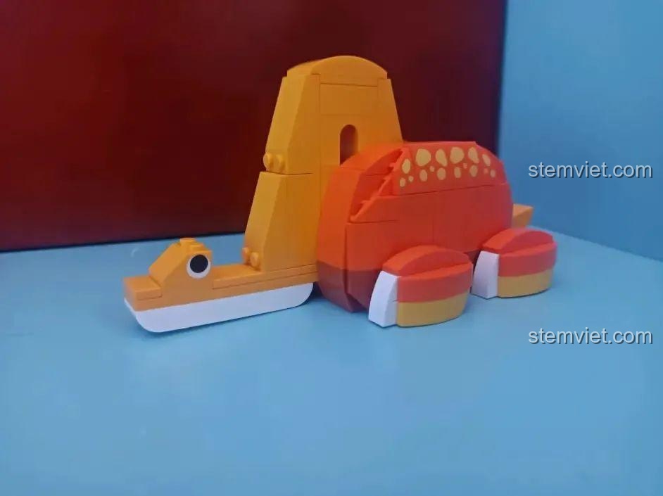 Mô hình hoàn chỉnh của đồ chơi mô hình JK5106 Khủng long Brachiosaurus, màu cam vàng, thiết kế đáng yêu, cho bé 8 tuổi.