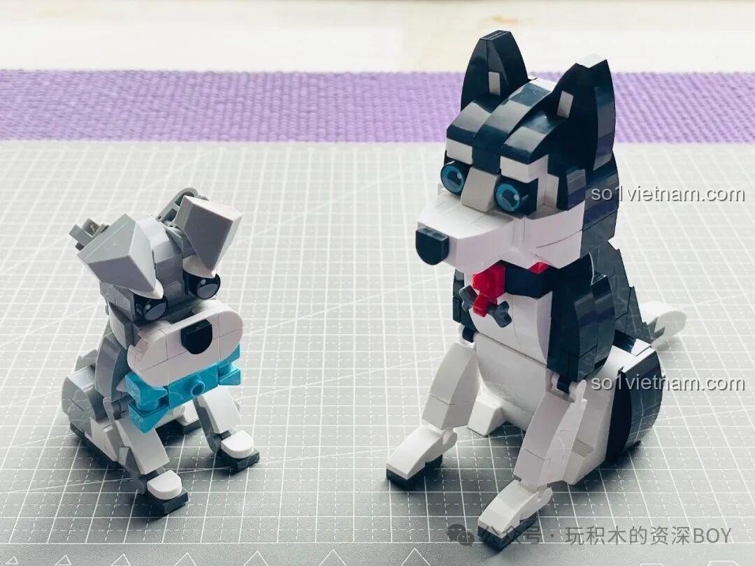 Cặp đôi mô hình chó Schnauzer và Husky JAKI JK8130 cùng nhau tạo dáng, mỗi bé một vẻ nhưng đều đáng yêu vô cùng.