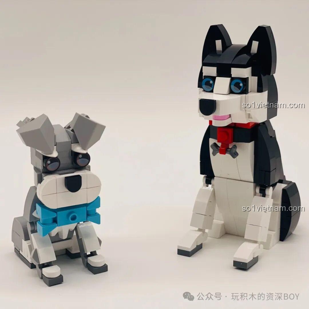 Hai mô hình chó Schnauzer và Husky JAKI JK8130 trên nền trắng, nổi bật từng chi tiết và màu sắc.