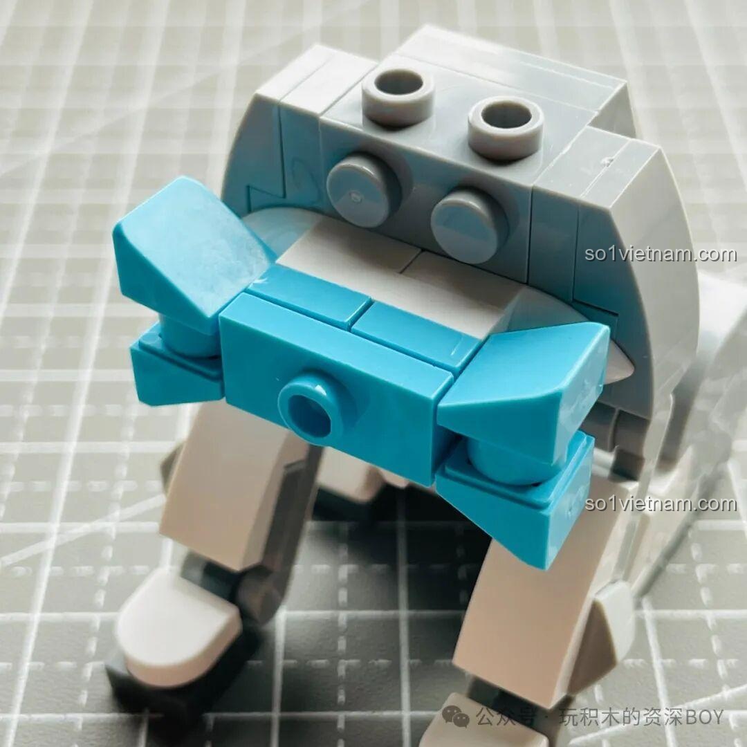 Phần thân mô hình chó Schnauzer của JAKI JK8130 với chiếc nơ màu xanh dương nổi bật.