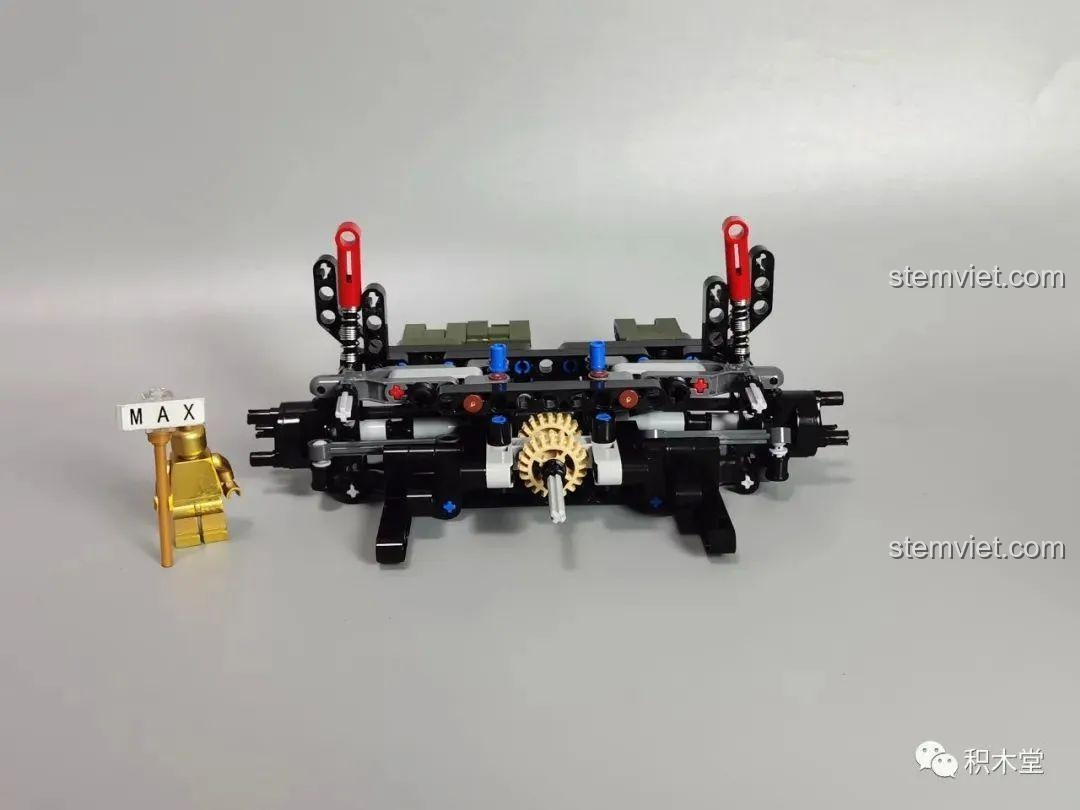 Khung gầm và cầu sau của Xe Jeep Quân Sự Mạnh Mẽ Taigaole T4015 đang được lắp ráp, thể hiện cấu trúc truyền động.