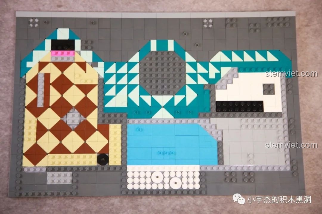 Quá trình lát gạch nền cho tầng trệt của bộ K-Box 10507 với các họa tiết caro và tam giác.