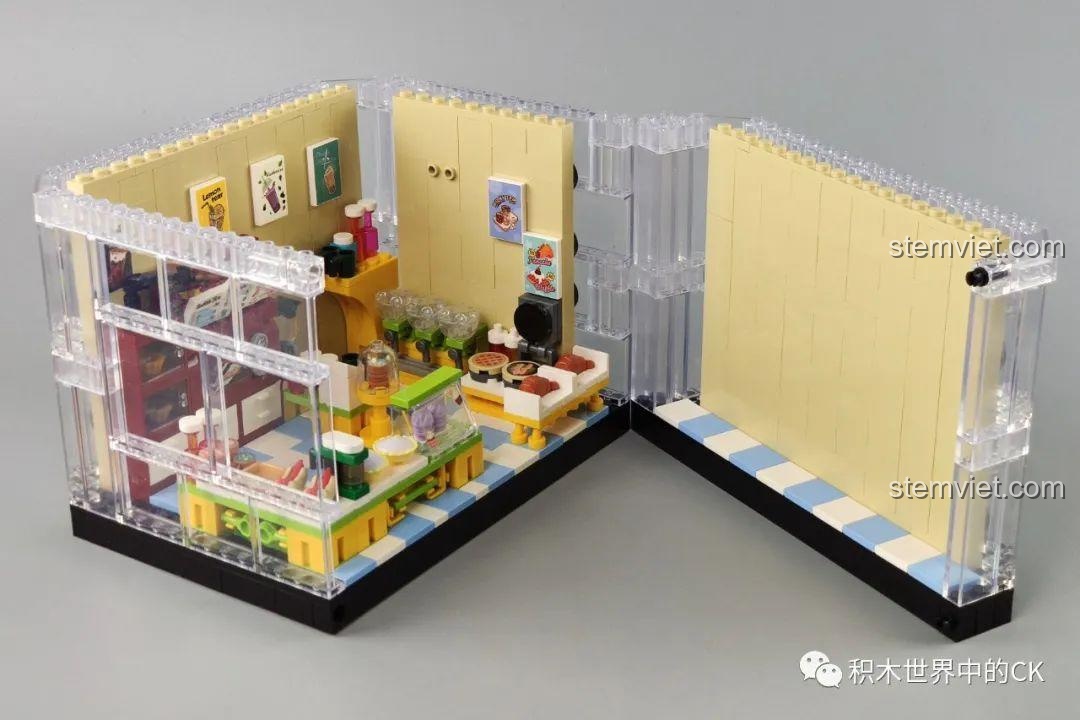Quá trình lắp ráp tầng trệt của mô hình Cửa hàng trà sữa JIAZHI SY 5209, với các bức tường và sàn nhà.
