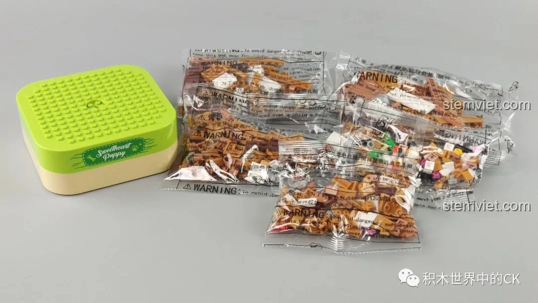 Các túi mảnh ghép và đế nhạc của bộ lắp ráp hộp nhạc chú chó con Sweetheart Puppy JAKI